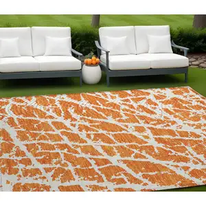 Photo of Orange and White Abstract Washable Non Skid Indoor Outdoor Area Rug