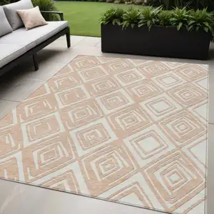 Photo of Peach And Ivory Geometric Washable Indoor Outdoor Area Rug