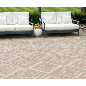 Photo of Peach And Ivory Geometric Washable Indoor Outdoor Area Rug