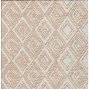 Photo of Peach And Ivory Geometric Washable Indoor Outdoor Area Rug