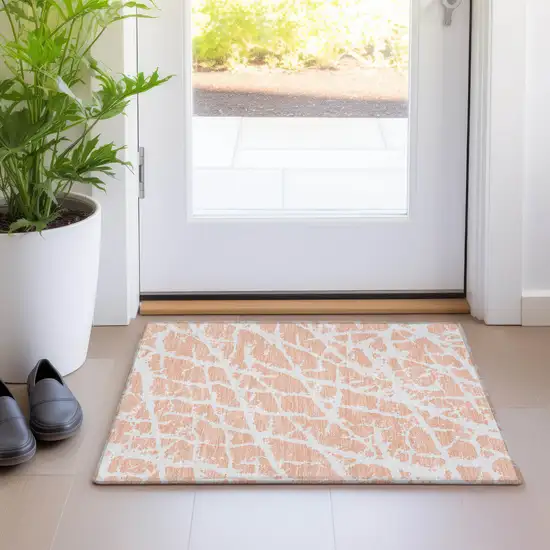 Peach and Ivory Abstract Washable Non Skid Indoor Outdoor Area Rug Photo 9