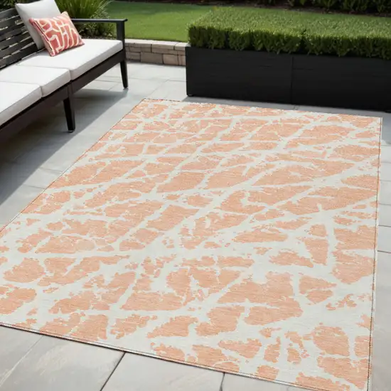 Peach and Ivory Abstract Washable Non Skid Indoor Outdoor Area Rug Photo 1