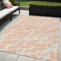 Photo of Peach and Ivory Abstract Washable Non Skid Indoor Outdoor Area Rug