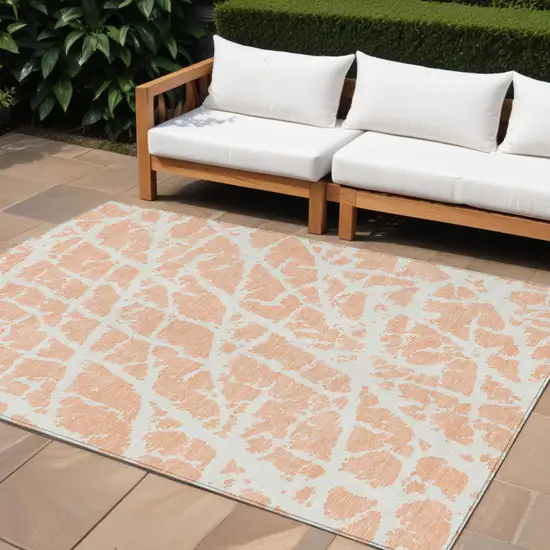 Peach and Ivory Abstract Washable Non Skid Indoor Outdoor Area Rug Photo 1