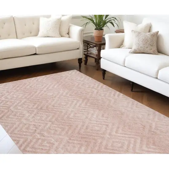 Pink And Ivory Geometric Stain Resistant Area Rug Photo 1