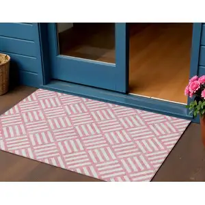 Photo of Pink And Ivory Geometric Washable Indoor Outdoor Area Rug