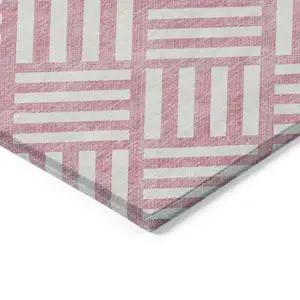 Photo of Pink And Ivory Geometric Washable Indoor Outdoor Area Rug