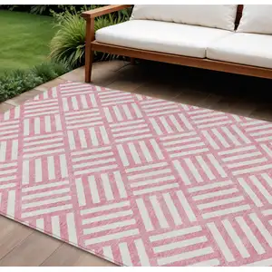 Photo of Pink And Ivory Geometric Washable Indoor Outdoor Area Rug