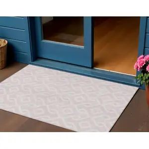 Photo of Pink And Ivory Geometric Washable Indoor Outdoor Area Rug