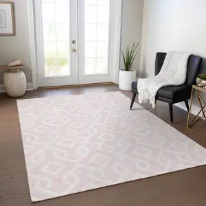 Photo of Pink And Ivory Geometric Washable Indoor Outdoor Area Rug