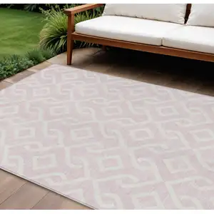 Photo of Pink And Ivory Geometric Washable Indoor Outdoor Area Rug