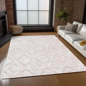 Photo of Pink And Ivory Geometric Washable Indoor Outdoor Area Rug