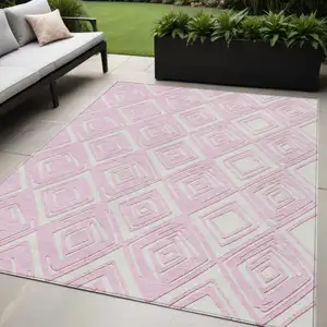 Photo of Pink And Ivory Geometric Washable Indoor Outdoor Area Rug