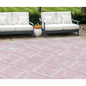 Photo of Pink And Ivory Geometric Washable Indoor Outdoor Area Rug