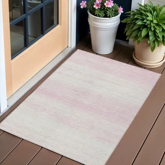 Pink And Ivory Striped Washable Indoor Outdoor Area Rug Photo 1