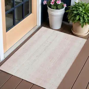 Photo of Pink And Ivory Striped Washable Indoor Outdoor Area Rug