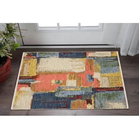 Pink Blue And Yellow Abstract Area Rug With Fringe Photo 1