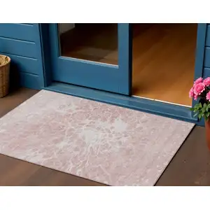 Photo of Pink Blush And Ivory Abstract Washable Indoor Outdoor Area Rug