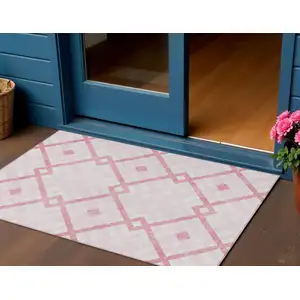 Photo of Pink Blush And Ivory Geometric Washable Indoor Outdoor Area Rug