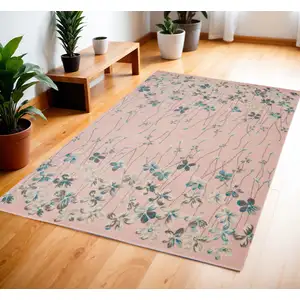 Photo of Pink Gray and Blue Botanical Leaves Area Rug