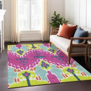 Photo of Pink Lime Green And Orange Ikat Washable Indoor Outdoor Area Rug