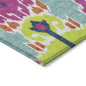 Photo of Pink Lime Green And Orange Ikat Washable Indoor Outdoor Area Rug