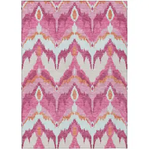 Photo of Pink Mauve And Orange Ikat Washable Indoor Outdoor Area Rug