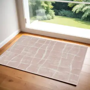 Photo of Pink and Ivory Abstract Area Rug