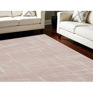 Photo of Pink and Ivory Abstract Distressed Non Skid Area Rug