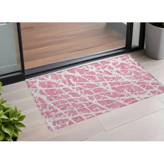 Pink and Ivory Abstract Washable Non Skid Indoor Outdoor Area Rug Photo 1