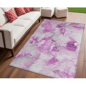 Photo of Pink and Ivory Abstract Washable Non Skid Indoor Outdoor Area Rug