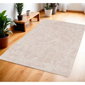 Photo of Pink and Ivory Floral Distressed Area Rug