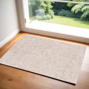 Photo of Pink and Ivory Floral Distressed Area Rug