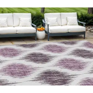 Photo of Purple Plum And Ivory Ikat Washable Indoor Outdoor Area Rug