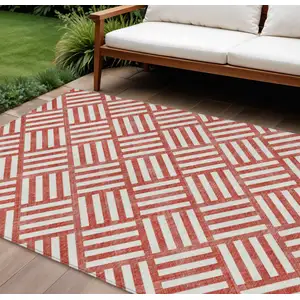 Photo of Red And Ivory Geometric Washable Indoor Outdoor Area Rug