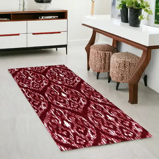 2' X 6' Red And White Ikat Tufted Washable Non Skid Area Rug Photo 1