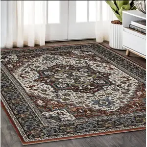 Photo of Red Black And White Medallion Area Rug With Fringe