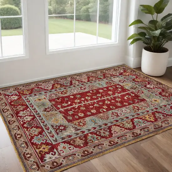 Red Blue And Brown Wool Floral Hand Knotted Distressed Stain Resistant Area Rug With Fringe Photo 1