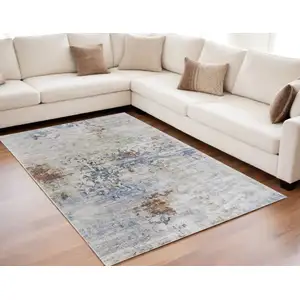 Photo of Red Blue and Ivory Abstract Power Loom Area Rug