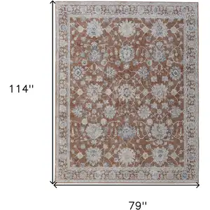 Photo of Red Blue and Ivory Floral Power Loom Worn Faded Area Rug With Fringe