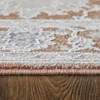 Photo of Red Blue and Ivory Floral Power Loom Worn Faded Area Rug With Fringe