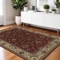 Photo of Red Ivory And Black Oriental Area Rug