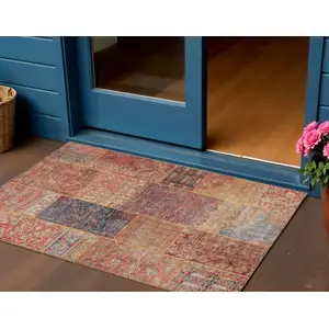 Photo of Red Orange And Blue Patchwork Washable Indoor Outdoor Area Rug