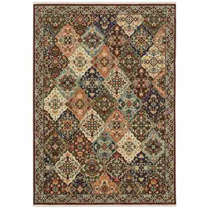 Photo of Red Rust Navy Light Blue Brown Orange Ivory And Gold Oriental Power Loom Stain Resistant Area Rug With Fringe