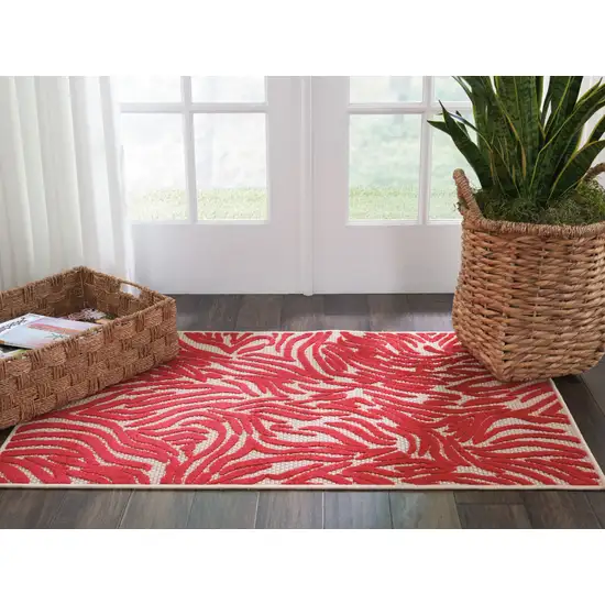 Red And Ivory Abstract Indoor Outdoor Area Rug Photo 8