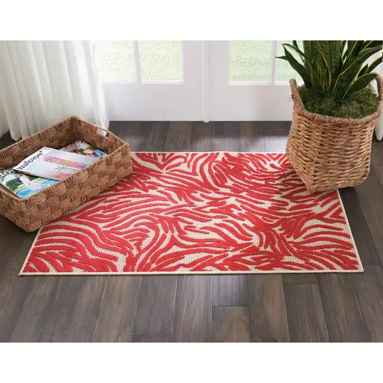 Red And Ivory Abstract Indoor Outdoor Area Rug Photo 7