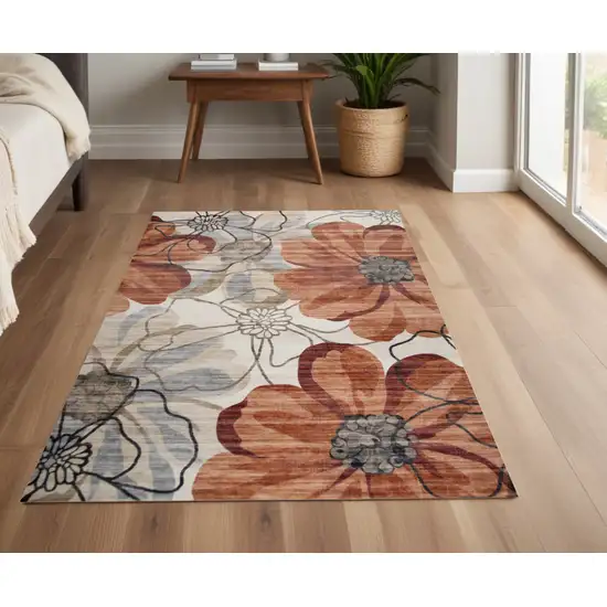 Red and Beige Floral Distressed Area Rug Photo 1