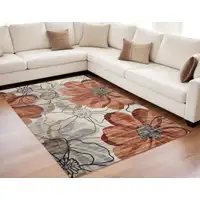 Photo of Red and Beige Floral Distressed Area Rug