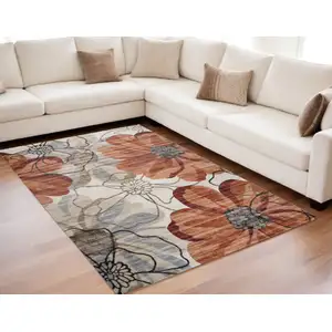 Photo of Red and Beige Floral Distressed Area Rug