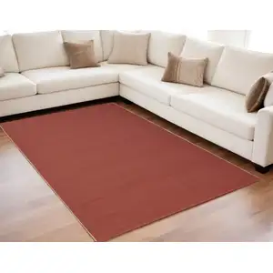 Photo of Red and Tan Hand Woven Area Rug